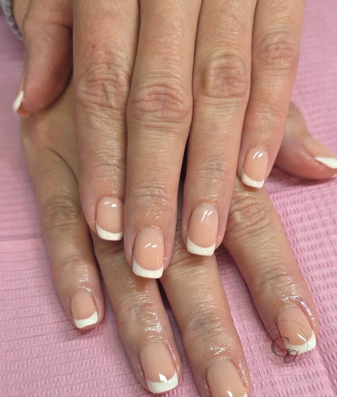 Classic white French on natural square nails.